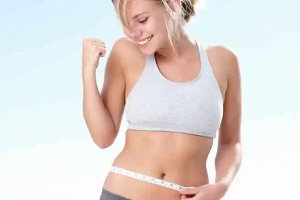 woman happy after fat reduction treatment Merseyside