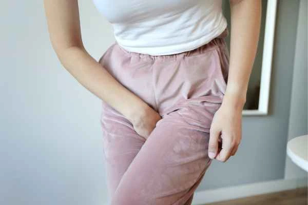 older woman running to the toilet because of urinary incontinence Merseyside